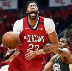  ?? — AP ?? Full of spirit: New Orleans Pelicans forward Anthony Davis (23) is fouled as he drives to the basket against Golden State Warriors forward Kevon Looney during the second-round NBA playoff match on Friday.