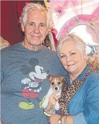  ?? ROSIE DIMANNO TORONTO STAR ?? Jerry and Gaye Bias with their rescue dog, Ruby-Sue. Jerry worked 45 years as a coal miner and Gaye opened a gift shop in Madison, W.V., in May, right in the middle of the pandemic.