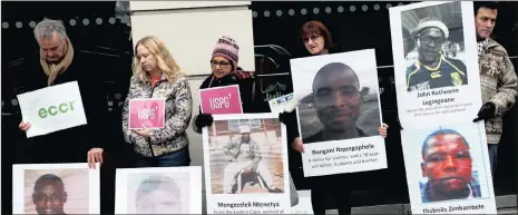  ?? PHOTO: REUTERS ?? Demonstrat­ors outside Lonmin’s annual general meeting in London yesterday. The company reported weaker than expected output, which saw its shares fall by more than 22 percent on the JSE yesterday.