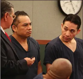  ?? STAFF FILE (2010) ?? Porfirio Duarte-herrara, right, and Omar Rueda-denvers, center, listen to a court interprete­r as District Court Judge Michael P. Villani sentences Rueda-denvers to life without parole Jan. 7, 2010, at the Regional Justice Center.