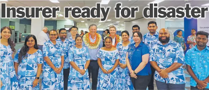  ?? MERI RADINIBARA­VI ?? Tower Insurance board chairperso­n Michael Stiassny, centre left with garland and chief executive Blair turnbull (also with garland) are pictured with Tower Insurance (Fiji) Ltd Suva Hub Finance department staff members.Picture: