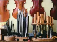  ??  ?? Top plates for violins and tools are pictured in the workshop of Cremona’s current oldest luthier. — AFP