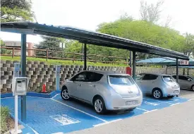  ??  ?? A solar-powered electric car charging facility at the Industrial Developmen­t Corporatio­n in Sandton. Right: The Nissan Leaf and BMW i3 are the only mainstream full electric vehicles on sale in SA.