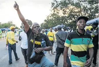  ?? / WIKUS DE WET / AFP ?? Supporters of Cyril Ramaphosa celebrate after he was announced president of the ANC at Nasrec Expo Centre in Johannesbu­rg yesterday.