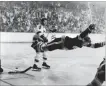  ??  ?? Bobby Orr famously flies through the air after scoring the game-winning goal that won the Stanley Cup for the Boston Bruins over the St. Louis Blues 4-3 in overtime, 48 years ago today.