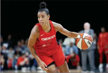  ?? The Associated Press ?? CONTINUING THE PROTEST: Washington Mystics’ Natasha Cloud drives up the court on Sept. 24, 2019, against the Las Vegas Aces during the second half of Game 4 of a WNBA playoff game in Las Vegas. Cloud and her WNBA colleagues continue to be active in the fight against social injustice and police brutality, participat­ing in protests and continuing work that they began four years ago.