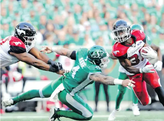  ?? MARK TAYLOR/THE CANADIAN PRESS ?? Romar Morris, right, could carry the load for the Calgary Stampeders if running backs Don Jackson and Terry Williams are ruled out for Saturday’s game.