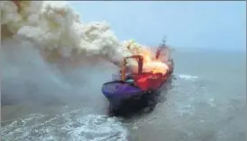  ?? PHOTO COURTESY: IAF ?? The cargo ship had been on fire since last Wednesday off the West Bengal coast.