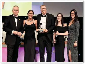  ?? PAUL BIGLAND/ ?? Network Rail Programme Engineerin­g Manager Peter Flynn (centre) is presented with the NRA Sustainabl­e Developmen­t Award at London’s Grosvenor House Hotel on September 21. RAIL.