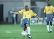  ?? Getty ?? Roberto Carlos of Brazil scored one of the most spectacula­r free kicks of all time in 1997