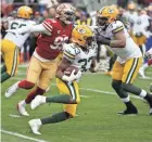  ?? MONICA M. DAVEY / EPA ?? Packers running back Aaron Jones had five 100-yard games on the ground last season with Matt LaFleur's wide-zone scheme.