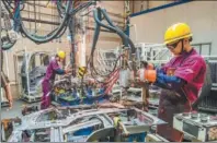  ?? WANG JILIN / FOR CHINA DAILY ?? Workers weld in a factory workshop in Qingzhou, Shandong province, on Tuesday.