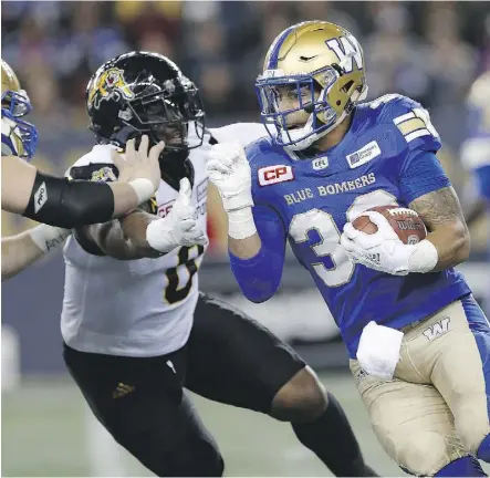  ?? JOHN WOODS/THE CANADIAN PRESS ?? Winnipeg running back Andrew Harris needs 181 yards rushing and 217 receiving yards to become the first CFL player to record 1,000 yards rushing and receiving in the same season.