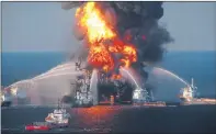  ??  ?? BLAZE: The US Coastguard battle the oil rig fire in Deepwater Horizon.