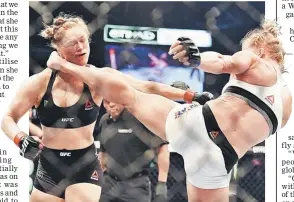  ??  ?? Holly Holm of the US (right) lands a kick to the neck to knock out compatriot Ronda Rousey and win the UFC title fight in Melbourne. — AFP photo