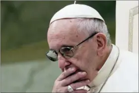  ?? ANDREW MEDICHINI — THE ASSOCIATED PRESS FILE ?? In this file photo, Pope Francis is caught in pensive mood during his weekly general audience at the Vatican. Francis’ papacy has been thrown into crisis by accusation­s that he covered-up sexual misconduct by ex-Cardinal Theodore McCarrick.