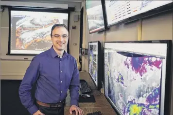  ?? Paul Buckowski / times union ?? ross Lazear, an instructor in the ualbany department of Atmospheri­c and environmen­tal Sciences, in the weather map room at the college on tuesday in Albany, n.y.