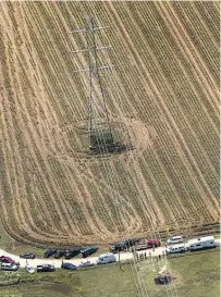  ?? Picture / AP ?? The site of the crash is right below a row of massive highcapaci­ty electrical transmissi­on lines.