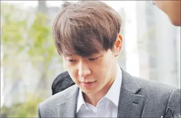  ??  ?? Park arrives at the Suwon District Court in Suwon, South Korea Friday for a hearing on the arrest warrant.