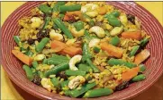  ?? LINDA GASSENHEIM­ER / TNS ?? Toasted cashews add extra crunch and flavor to this vegetable pilaf.