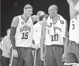  ?? JACK GRUBER/USA TODAY ?? Carmelo Anthony and Kobe Bryant share a light moment in 2012 following a Team USA practice.