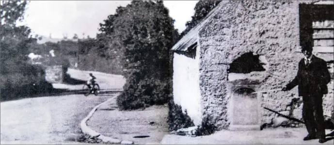  ??  ?? A local man pointing out the spot where Martin Savage was felled by the bullet at Ashtown, Co. Dublin