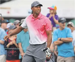  ?? JIM DEDMON/USA TODAY SPORTS ?? Tiger Woods watches his tee shot on the eighth hole during the third round of the Wells Fargo Championsh­ip golf tournament at Quail Hollow Club.