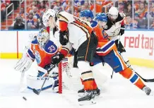  ??  ?? Anaheim’s Jakob Silfverber­g tries to get off a backhander at Oilers goalie Cam Talbot during Game 2. Silfverber­g has six goals in the playoffs, including four against the Oilers.