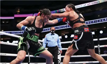  ??  ?? Jessica McCaskill lands a punch on Cecilia Braekhus during their welterweig­ht title fight on Saturday night in Dallas. Photograph: Ed Mulholland/Matchroom.