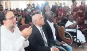  ??  ?? Senator Mark Golding (left) and MP Omar Davies (centre) join family and friends of Bunny Robinson in bidding farewell.