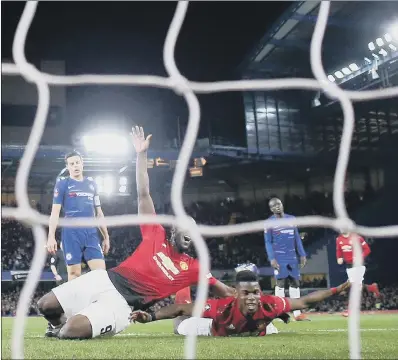  ?? PICTURE: NIGEL FRENCH/PA WIRE ?? DOUBLING UP: Manchester United’s Paul Pogba, right, celebrates scoring his side’s second goal as they defeated Chelsea 2-0 at Stamford Bridge in the FA Cup fifth round having lost to the Blues in last season’s final.
