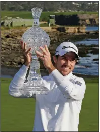  ?? (AP/Eric Risberg) ?? Nick Taylor won the AT&T Pebble Beach Pro-Am on Sunday after finishing with a 19-under 268. He earned a two-year exemption on the PGA Tour with the victory.