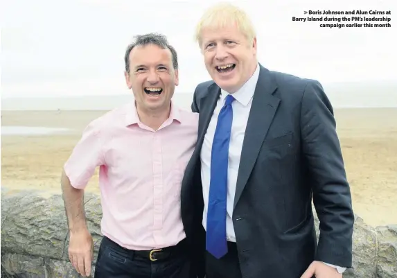  ??  ?? > Boris Johnson and Alun Cairns at Barry Island during the PM’s leadership campaign earlier this month