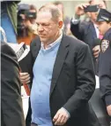  ?? DON EMMERT/AFP/GETTY IMAGES ?? Harvey Weinstein surrenders to authoritie­s Friday in New York.