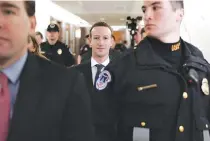  ??  ?? FACEBOOK CEO Mark Zuckerberg (C) is scheduled to testify before a few US Congressio­nal committees this week on the mass users data Facebook has shared with political operatives.