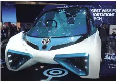  ?? ALEX WONG, GETTY IMAGES ?? The Toyota FCV Plus is a hydrogen fuel-cell concept vehicle capable of generating electricit­y directly from hydrogen.