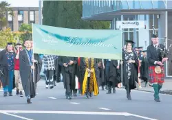  ?? PHOTO / TANIA WHYTE ?? Two years’ worth of NorthTec grads walk down Water St, Whangārei.