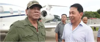  ?? (Presidenti­al Photo) ?? President Rodrigo Duterte and Sulu gubernatio­nal bet Sakur Tan.