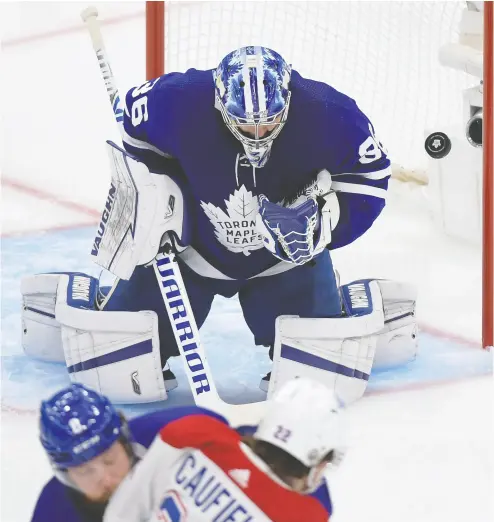  ?? DAN HAMILTON / USA TODAY SPORTS ?? Leafs goalie Jack Campbell makes a save on the Canadiens on Thursday at Scotiabank Arena in Toronto in Game 5 of the first round of the Stanley Cup Playoffs. Game 6 goes Saturday evening in Montreal, with limited fans.