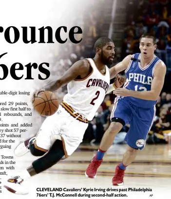 ?? AP ?? CLEVELAND Cavaliers’ Kyrie Irving drives past Philadelph­ia 76ers’ T.J. McConnell during second-half action.