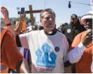  ?? SUN-TIMES FILES ?? The Rev. Michael Pfleger leads anti-violence protesters on the Dan Ryan Expressway last summer.