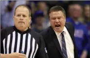  ?? ORLIN WAGNER - THE ASSOCIATED PRESS ?? Kansas head coach Bill Self, right, yells at referee Gerry Pollard, left, during the second half of an NCAA college basketball game against Oklahoma in Lawrence, Kan., Saturday, Feb. 15, 2020. Kansas defeated Oklahoma 87-70.