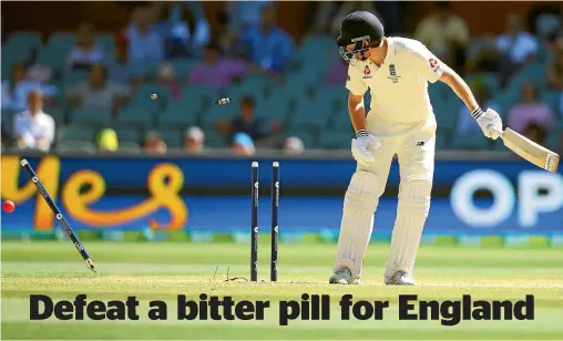  ?? PHOTOS: GETTY IMAGES ?? It’s game over for England as Jonny Bairstow is bowled by Australian fast bowler Mitchell Starc to end the second Ashes test in Adelaide.