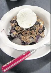  ?? TAMMY LJUNGBLAD/KANSAS CITY STAR ?? Try Lemon Blueberry Brown Betty topped with a scoop of frozen nonfat yogurt ice.