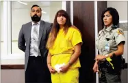 ?? AP PHOTO BY SCOTT SMITH ?? Obdulia Sanchez, 18, middle, appears in a Los Banos, Calif., branch of the Merced County Superior Court on Monday, with her public defender, Ramnik Samrao. She's accused of causing a crash that killed her younger sister while livestream­ing on Instagram.