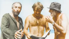  ?? Vegas Media ?? Peter Sellers (left), Peter Medak and Spike Milligan on the set of “Ghost in the Noonday Sun.” Medak’s new documentar­y delves into the disastrous shoot.