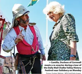  ?? Picture: Finnbarr Webster - WPA Pool/Getty Images ?? Camilla, Duchess of Cornwall meets a re-enactor during a tour of the Daily Mail Chalke Valley History Festival near Salisbury on Monday