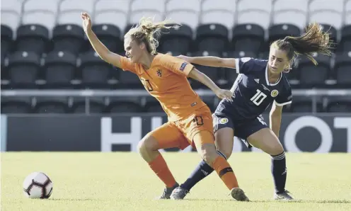  ??  ?? 0 Kerstin Casparij of the Netherland­s evades the challenge of Scotland’s Jamie-lee Napier in last night’s Under-19 internatio­nal.