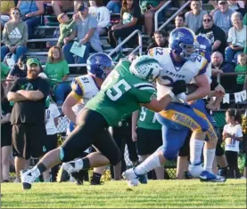  ?? PILOT FILE PHOTO/BEV HARAMIA ?? Bremen’s Easton Reed (65) makes this tackle against Triton earlier this season. The Lions’ defense will be tested against the SB Riley offense this week.