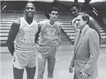  ?? ASSOCIATED PRESS ?? This is an October 14, 1982 photo of Michael Jordan, far left, Matt Doherty, Sam Perkins and coach Dean Smith, far right, of the University of North Carolina.